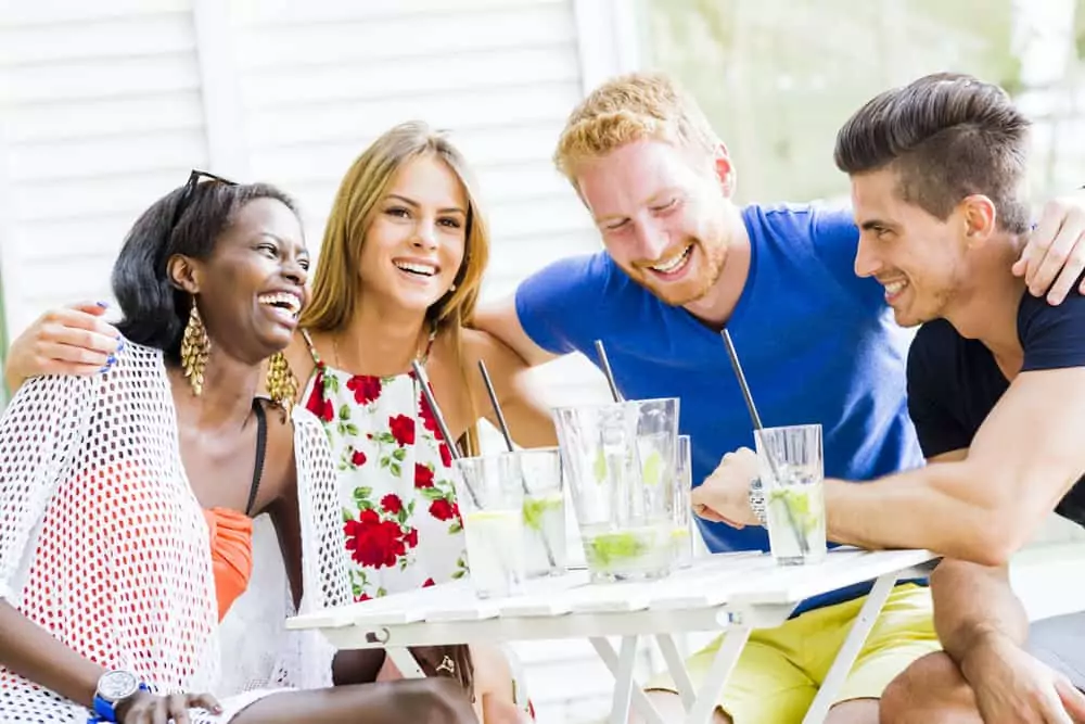 group laughing at a table